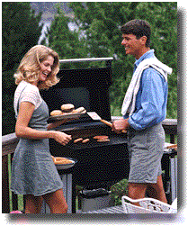 [Image of a couple BBQing]